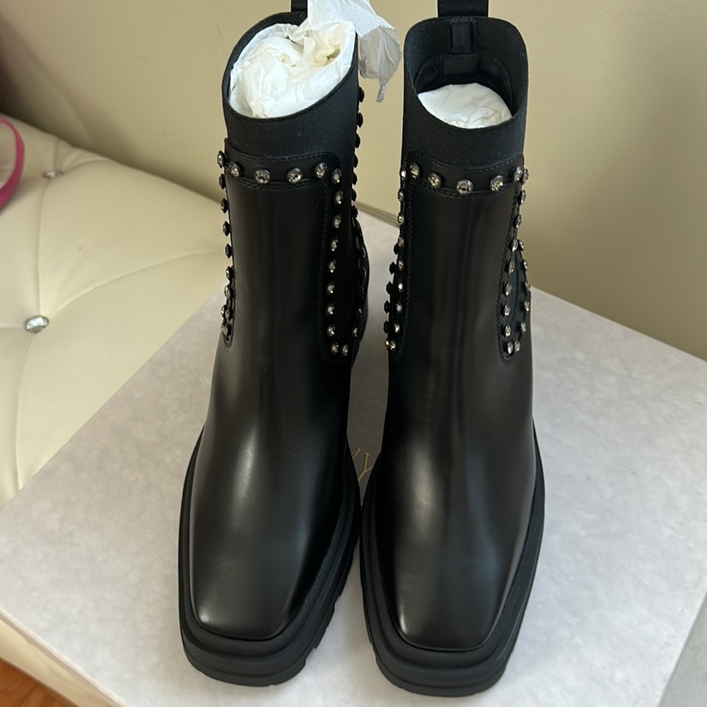 Jimmy Choo. Brand new. In the box. Dust bag is included.